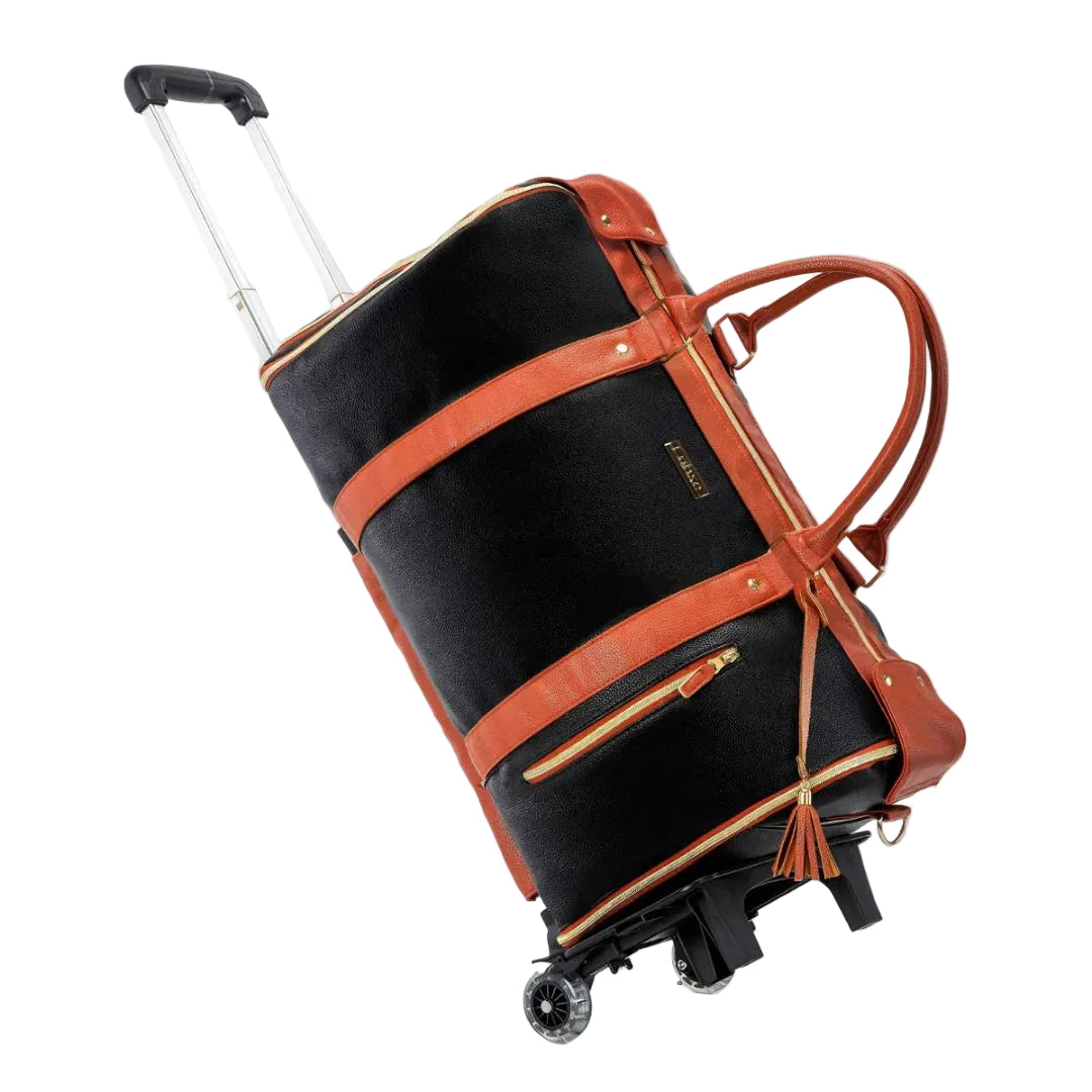 Black suitcase with brown leather straps on a white background