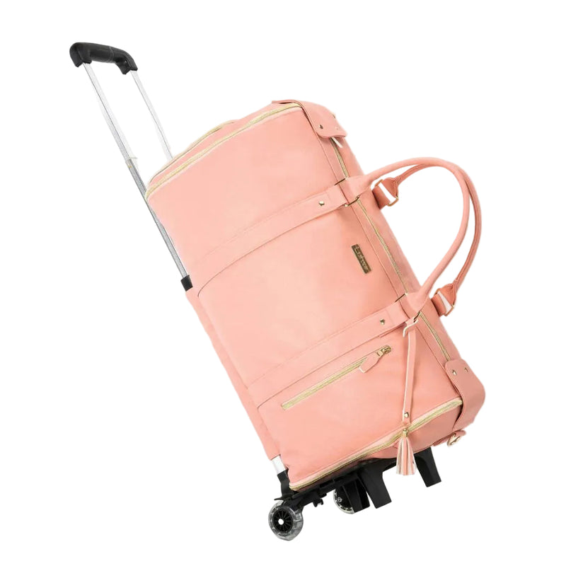 Pink rolling suitcase on a white background