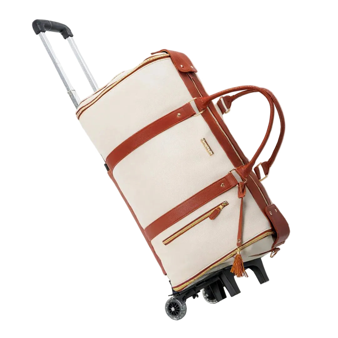 Beige suitcase with brown straps on a white background